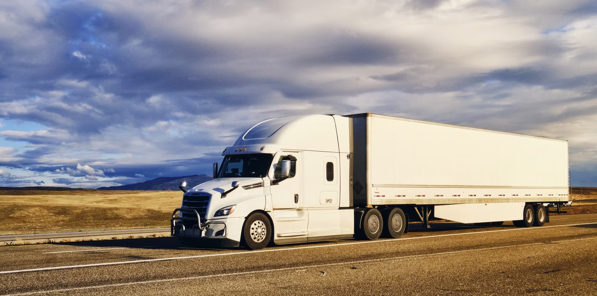 J&M HOTSHOTS LLC tractor and dry van trailer on the interstate